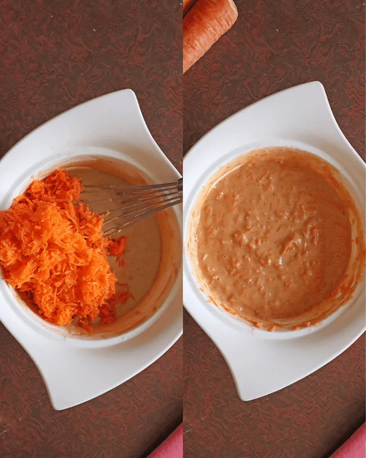 Shredded carrots being folded into the muffin batter with a spatula