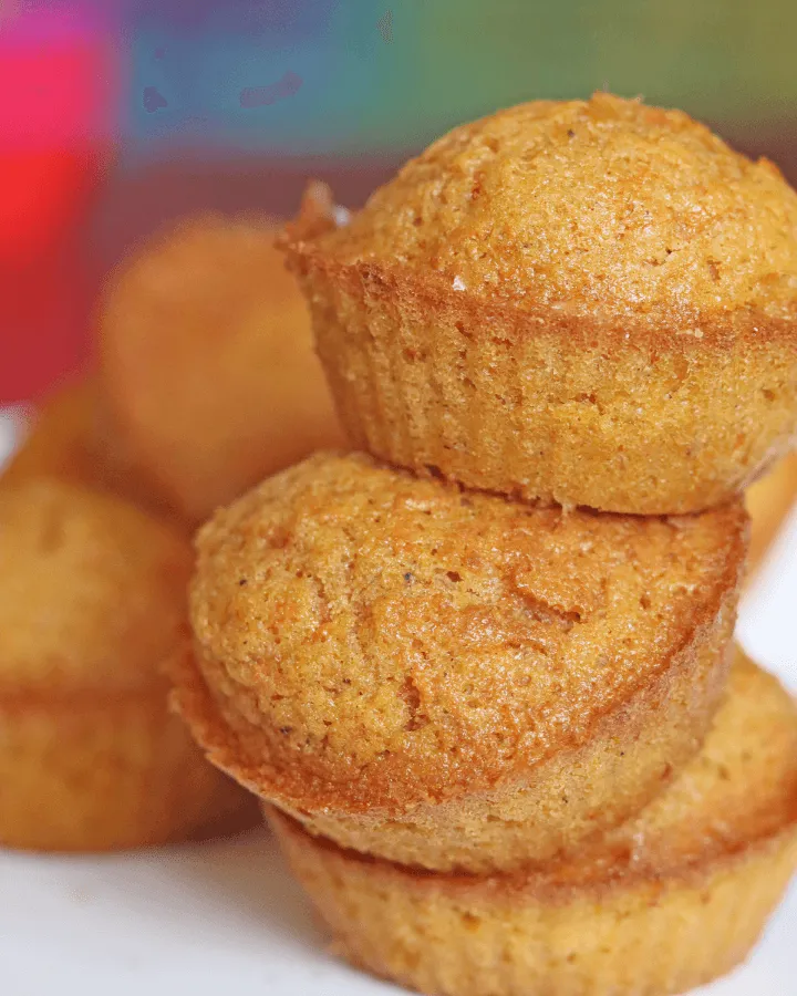 Carrot muffins baking in an air fryer basket