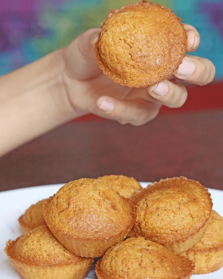 Close-up of a fluffy carrot muffin split in half