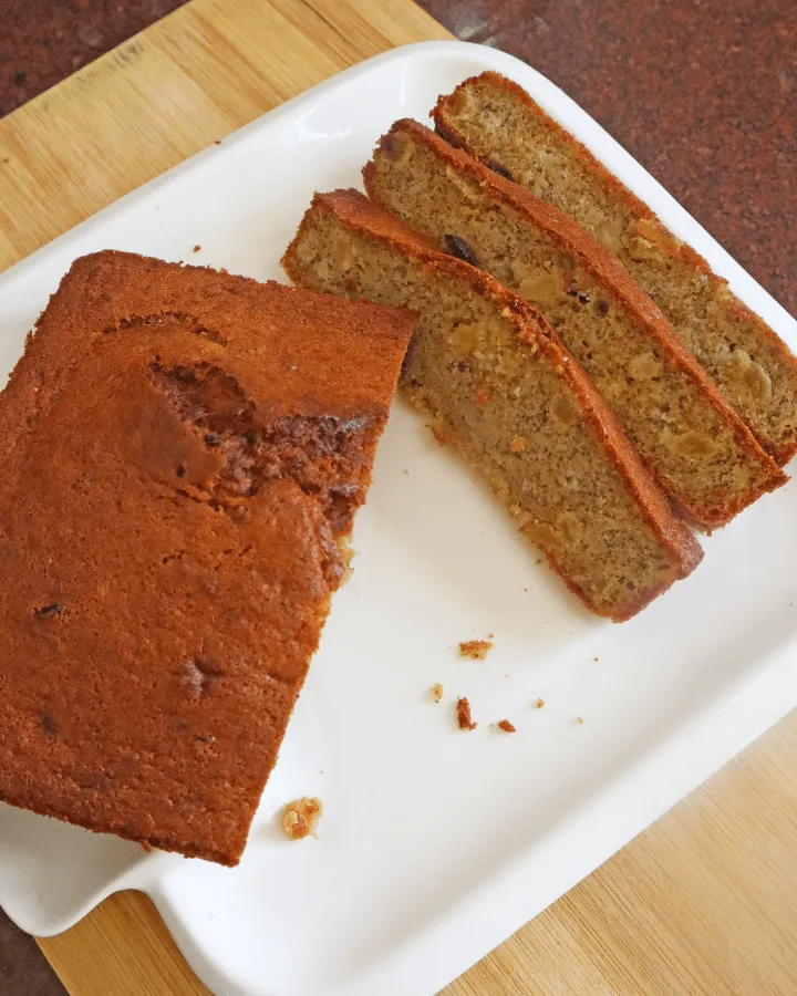 Healthy air fryer banana bread sliced on a board
