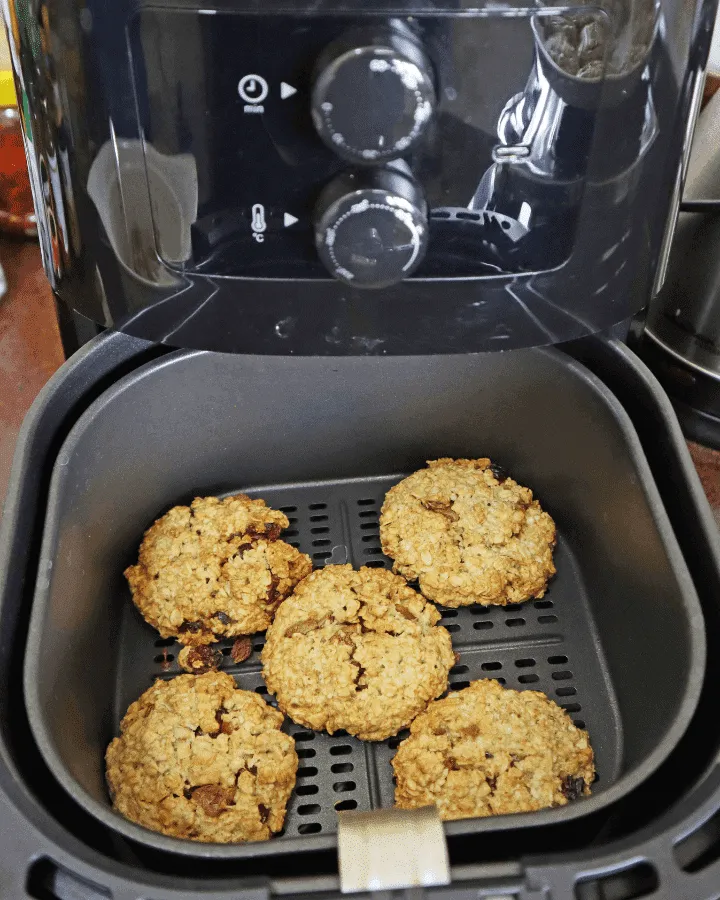 Oatmeal cookies cooking in the air fryer basket