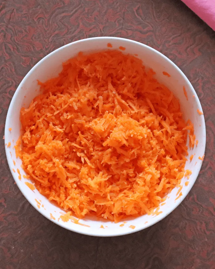 Freshly shredded carrots in a bowl