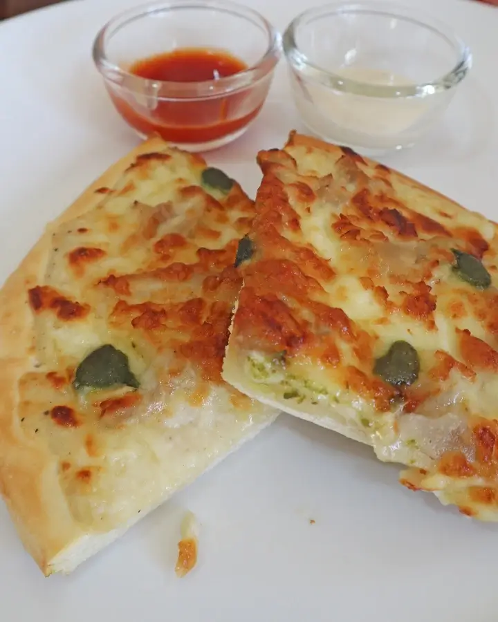 Crispy air fryer frozen pizza with melted cheese and a golden browned crust