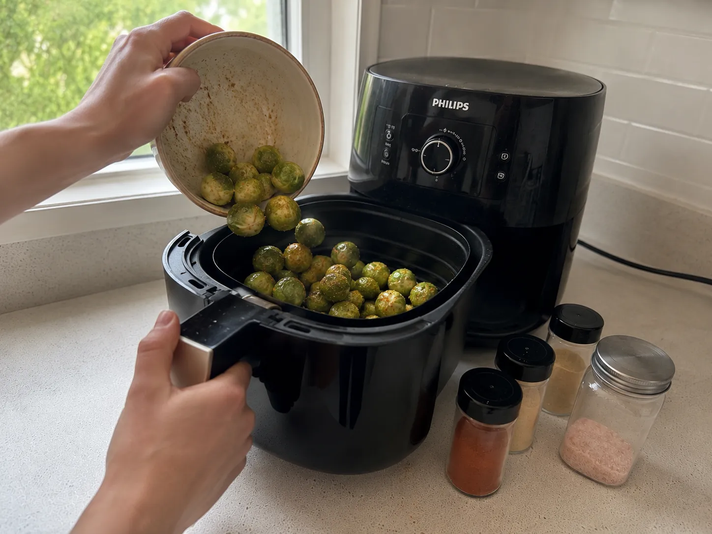 Air fryer Brussels sprouts plated as a side dish with a main course