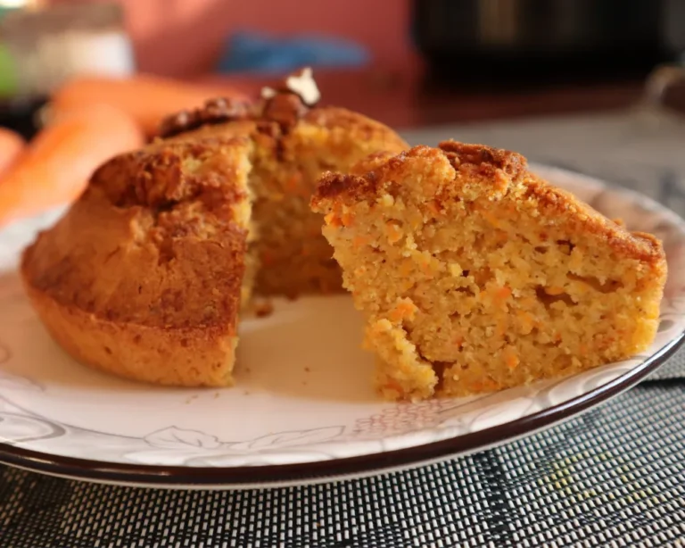 A slice of moist air fryer carrot cake on a plate