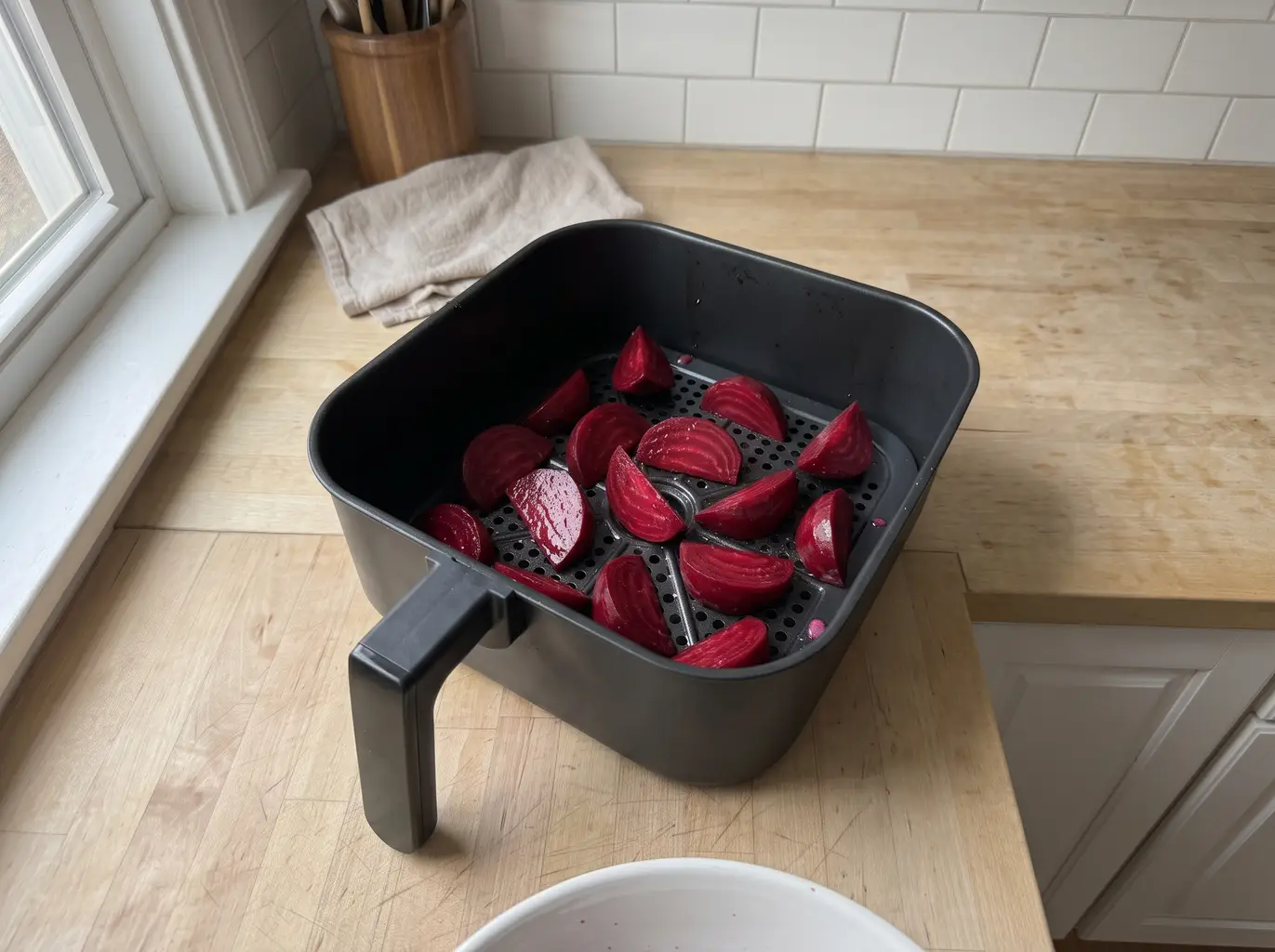 Beet wedges in a single layer in the air fryer basket