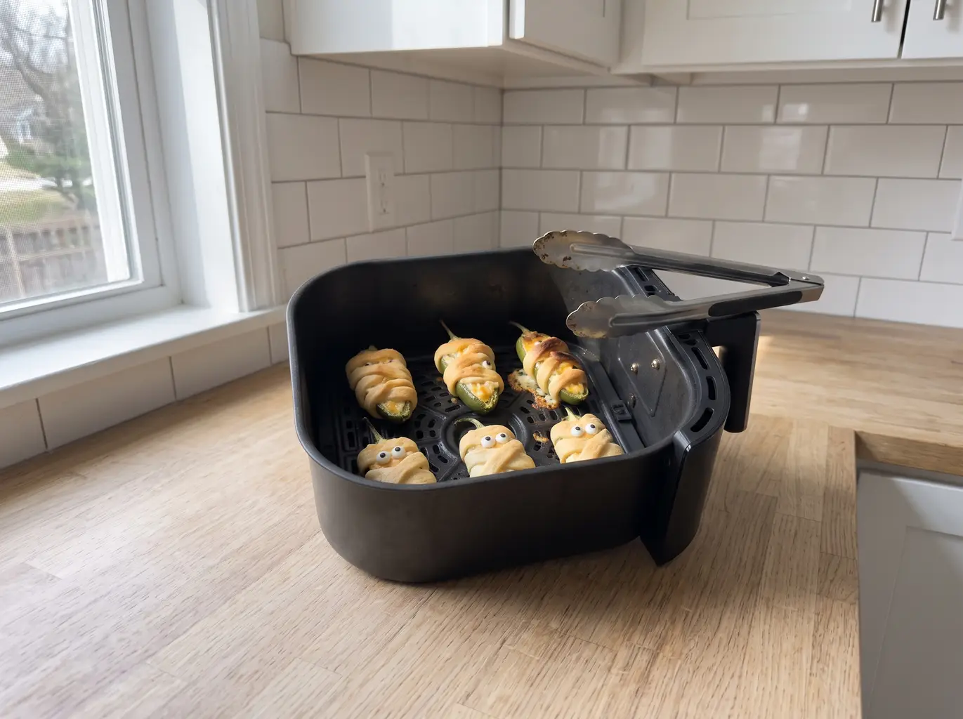 Golden air fryer mummy jalapeno poppers with eyes