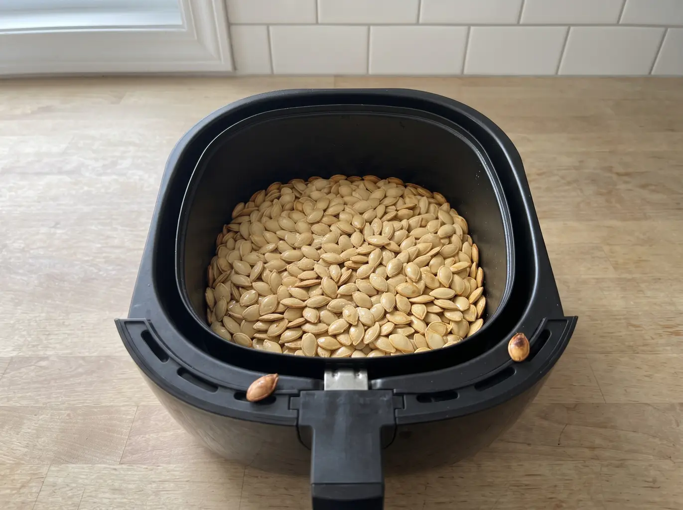 Crispy roasted pumpkin seeds fresh from the air fryer basket