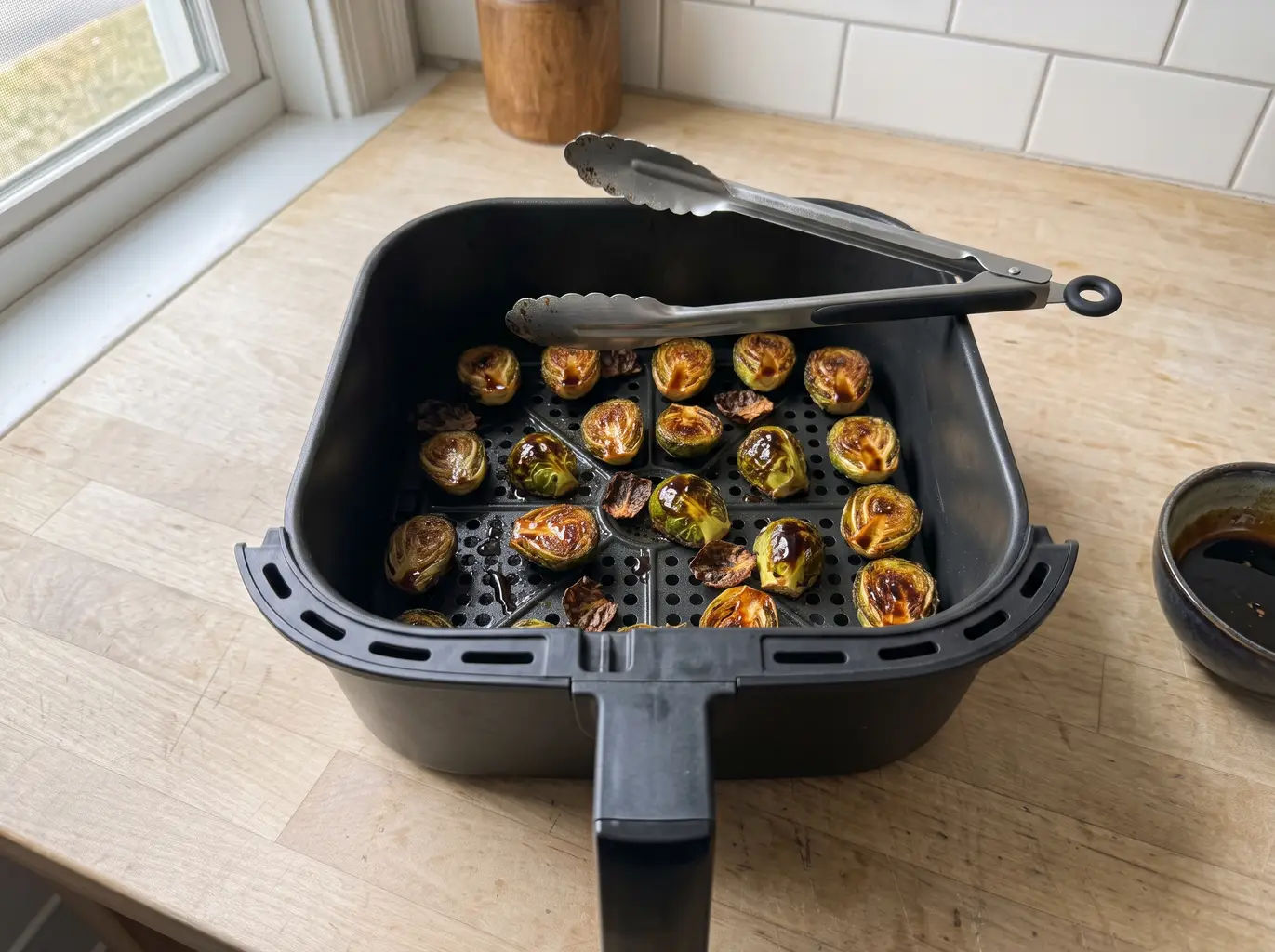 Brussels sprouts tossed with balsamic glaze in the basket