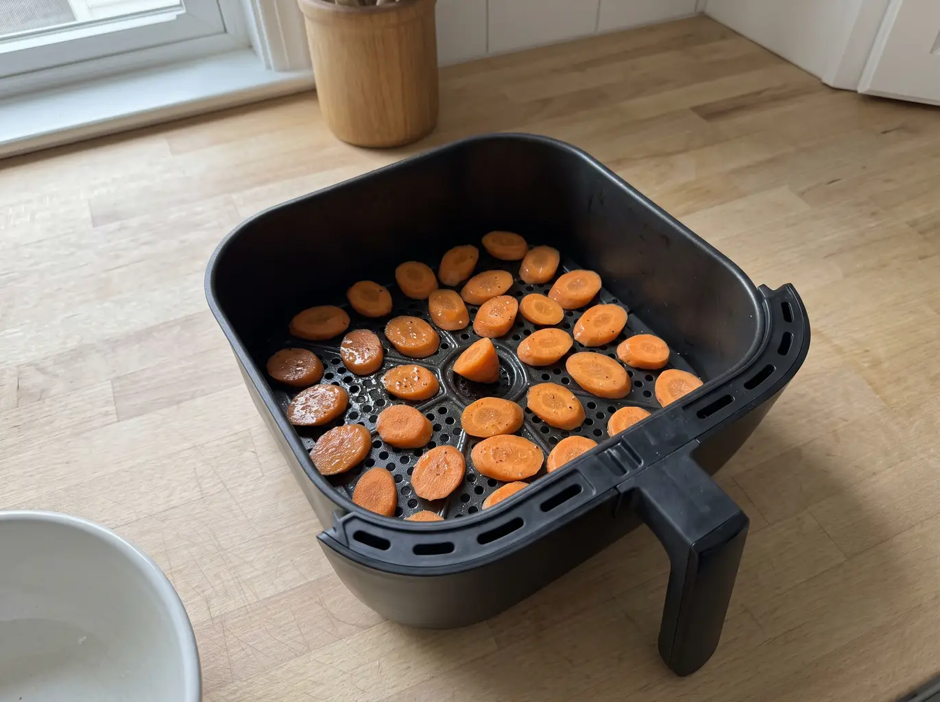 Carrots in a single layer in the air fryer basket