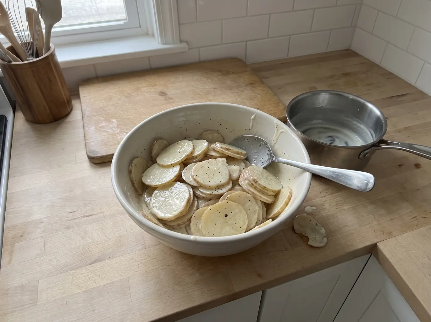 Potato slices coated in the warm seasoned cream