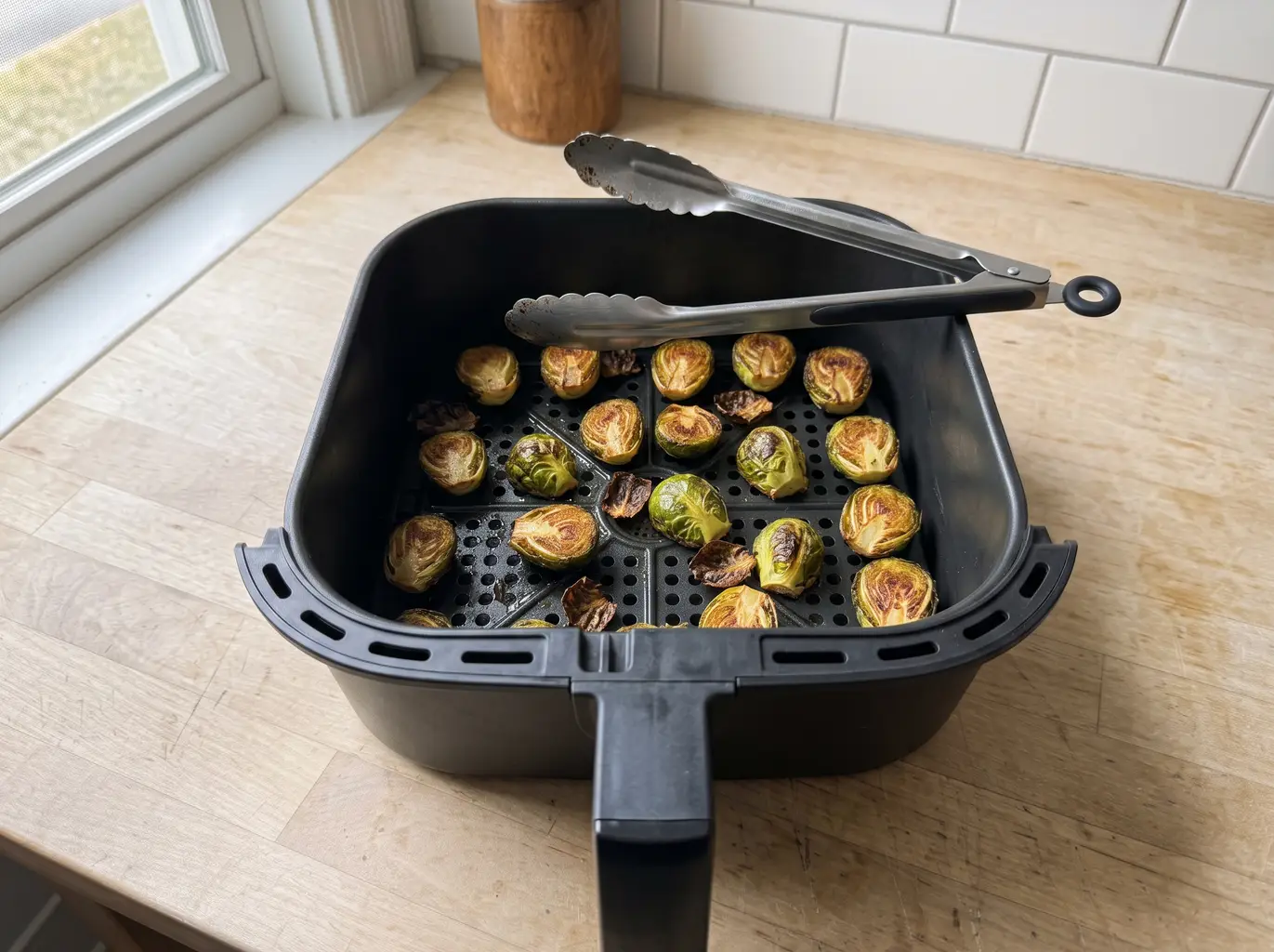 Roasted crispy Brussels sprouts in the air fryer basket