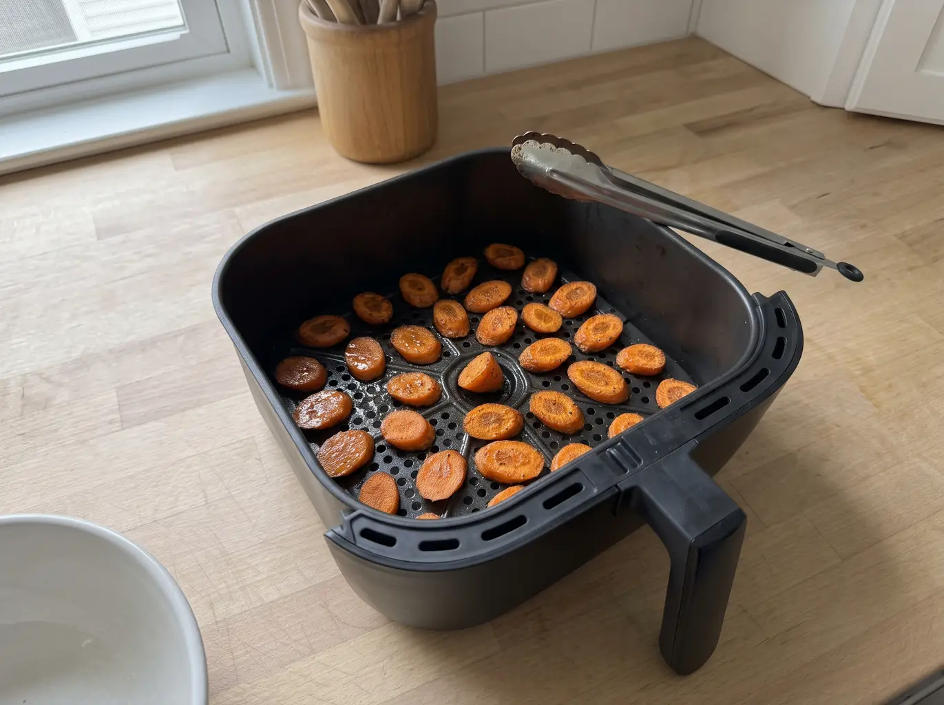 Caramelized roasted carrots in the air fryer basket