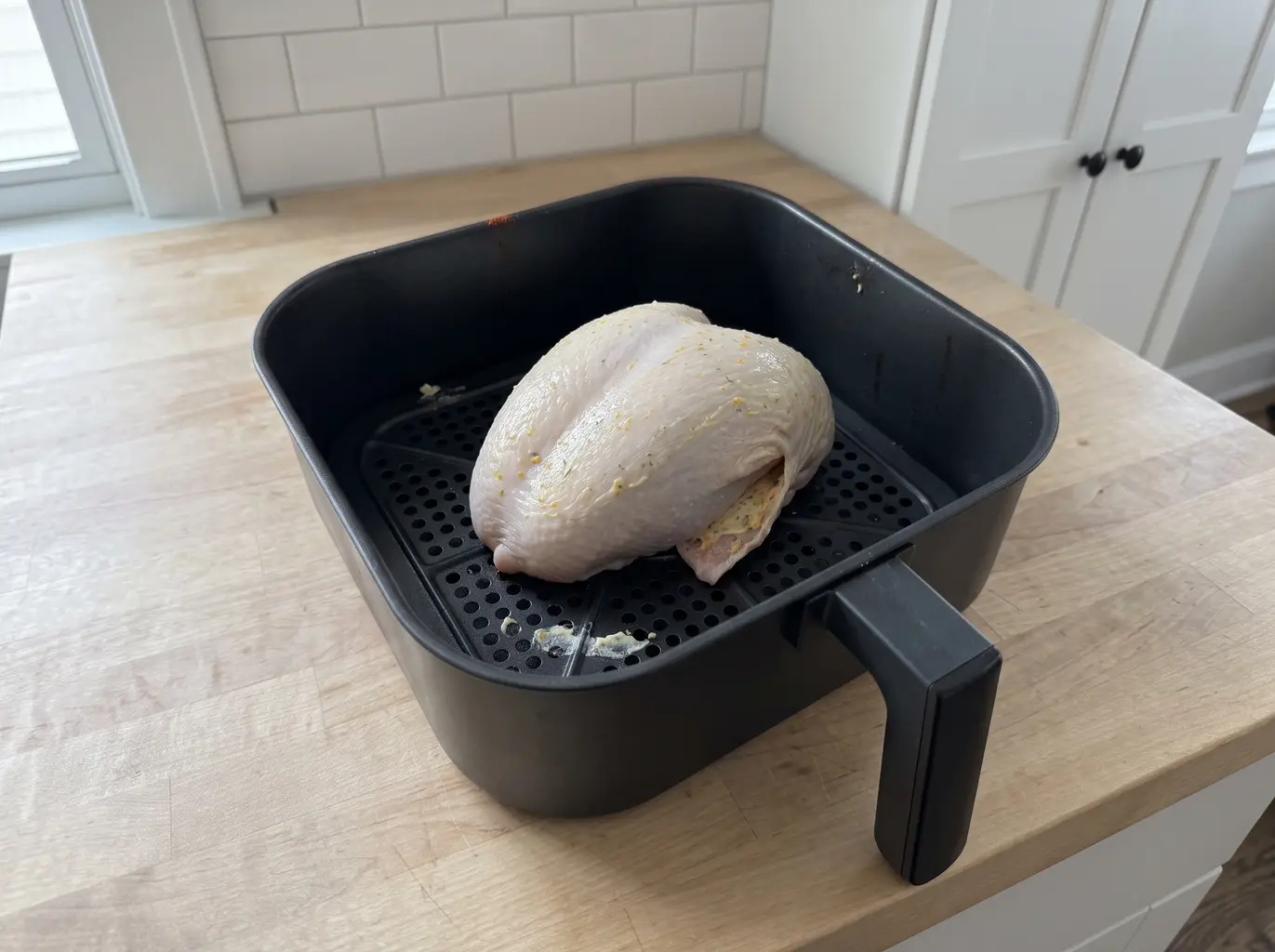 Turkey breast skin side down in the air fryer basket